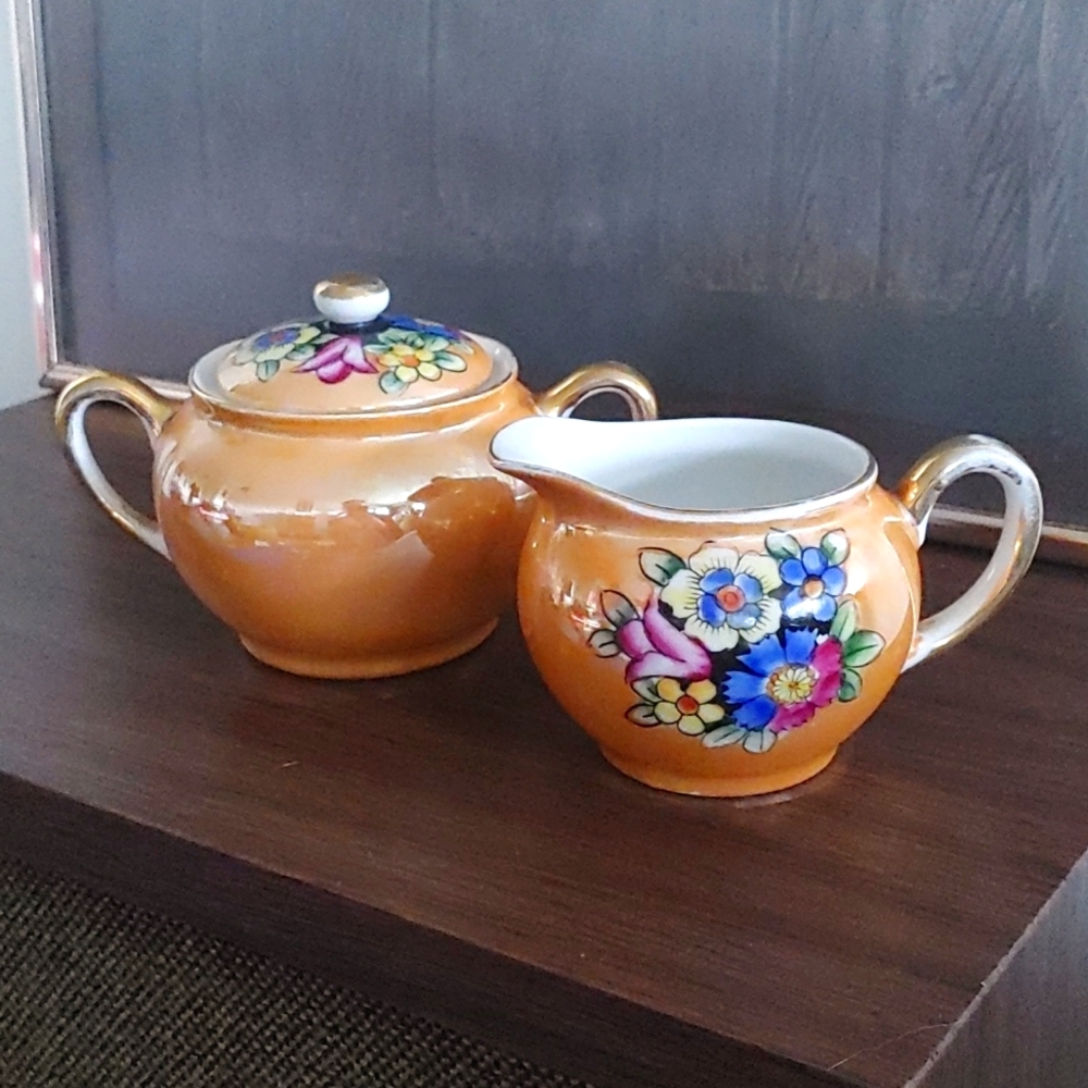 Vintage Noritake Japan cream and sugar set. Orange lusterware hand painted.